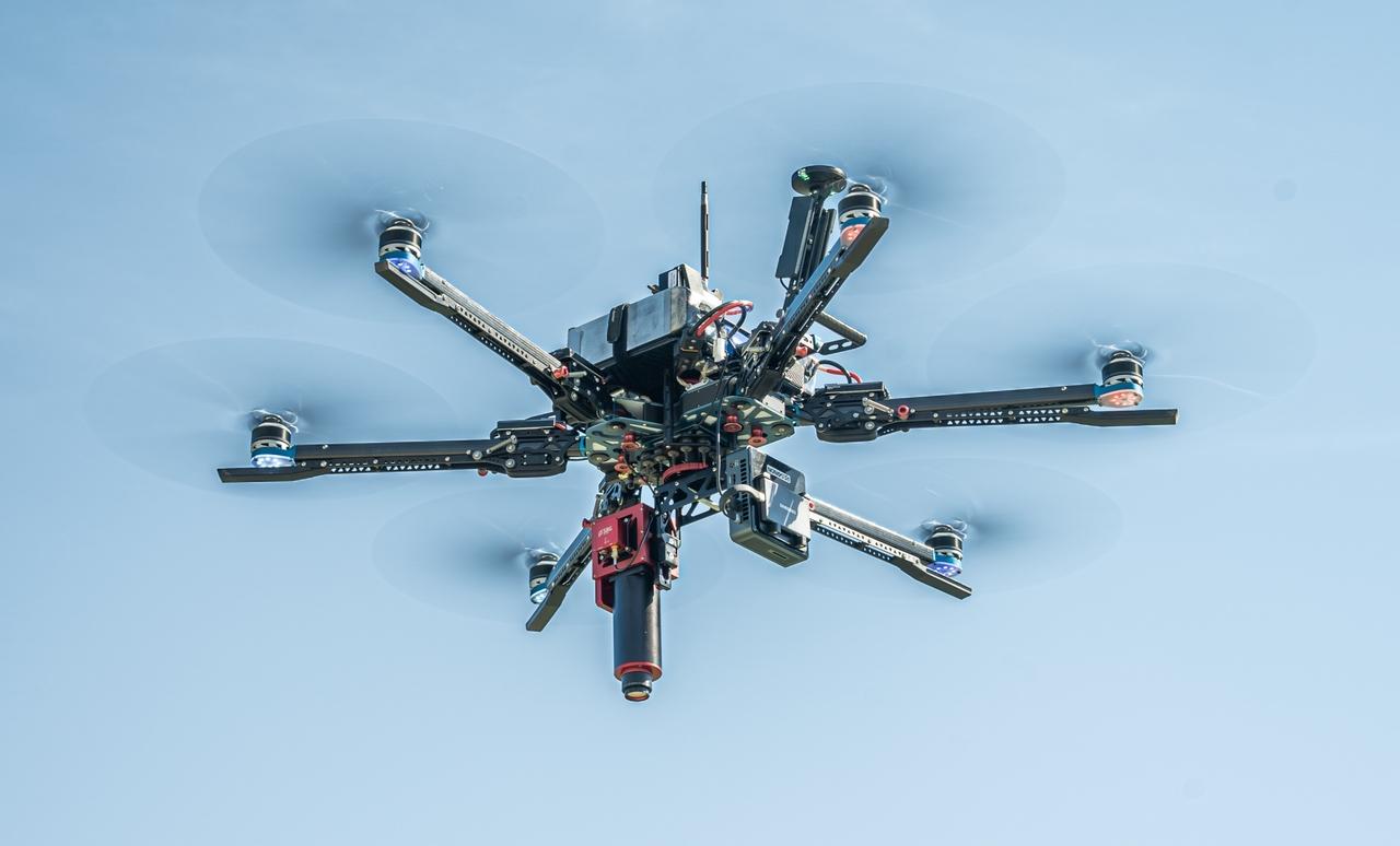 Vision Aerial Vector hexacopter with Pika IR-L Hyperspectral Imaging Airborne System in flight looking up